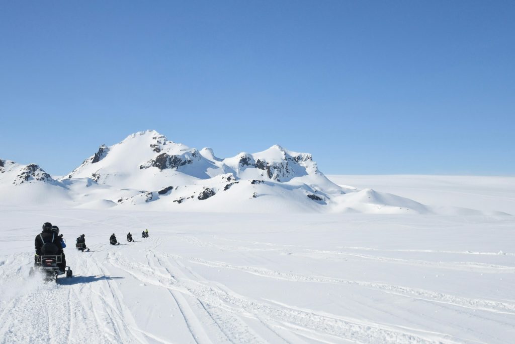 Riding snowmobile on glacier iceland