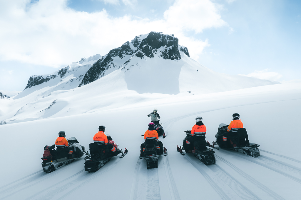 play snowmobile on the icelandic glacier Langjökull , close to golden circle