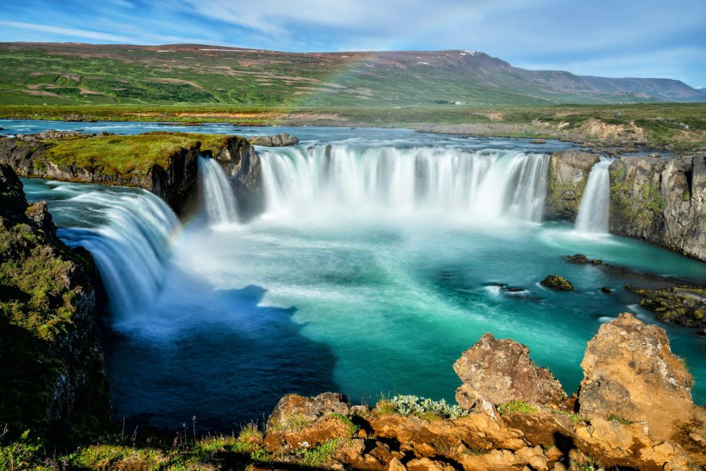 visit godafoss in summer time