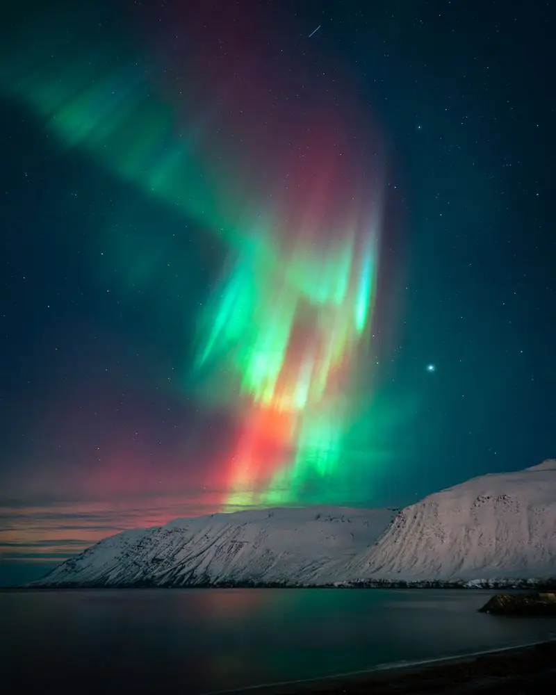 Northern Lights over a fjord in Iceland